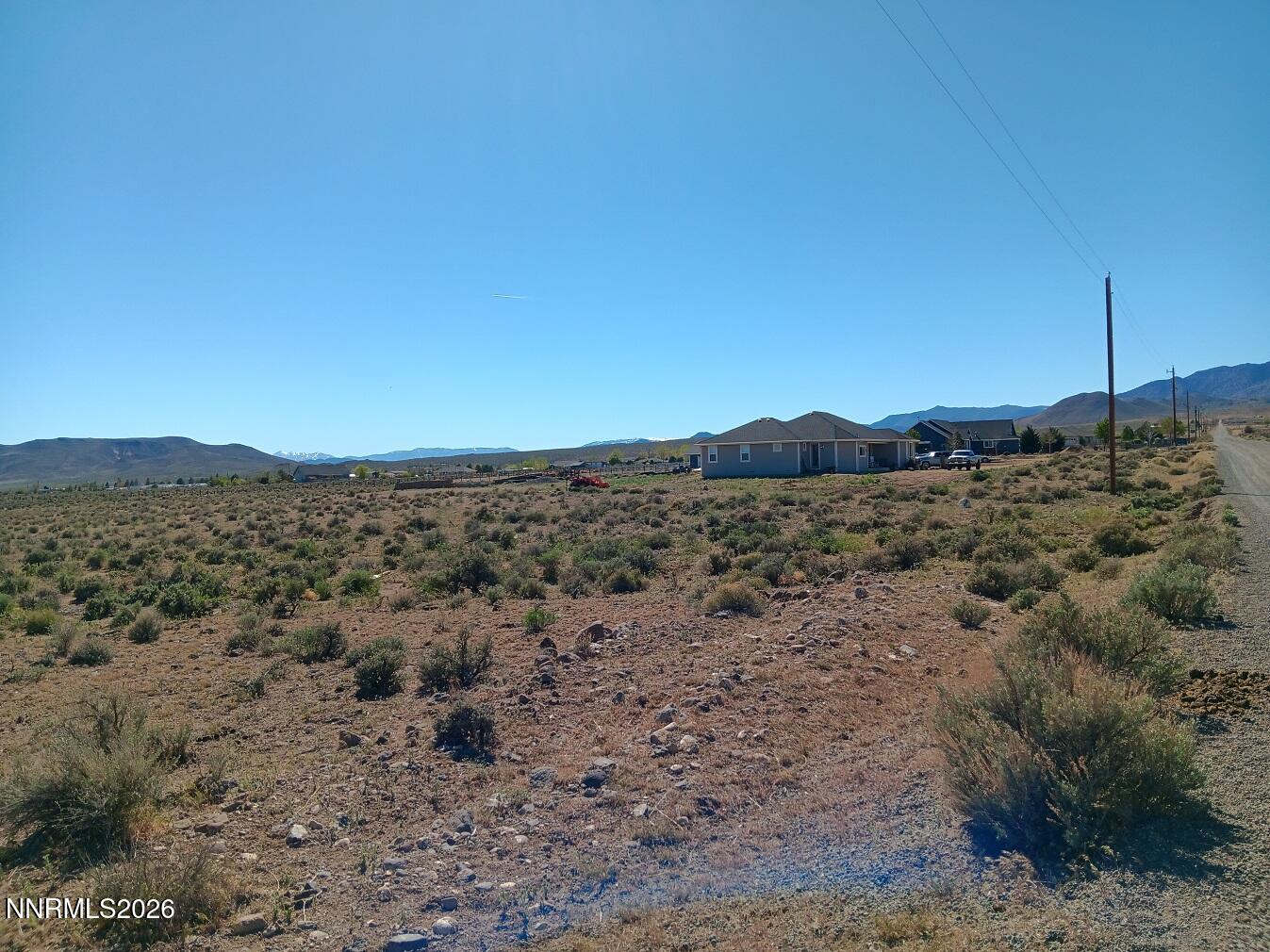 12405 Seneca Road Stagecoach, NV 89429 - Photo 5 of 6 a view of a road with a building in the background