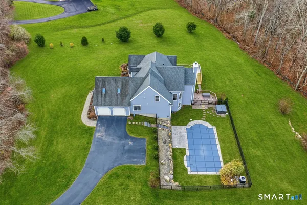 an aerial view of a house with a garden