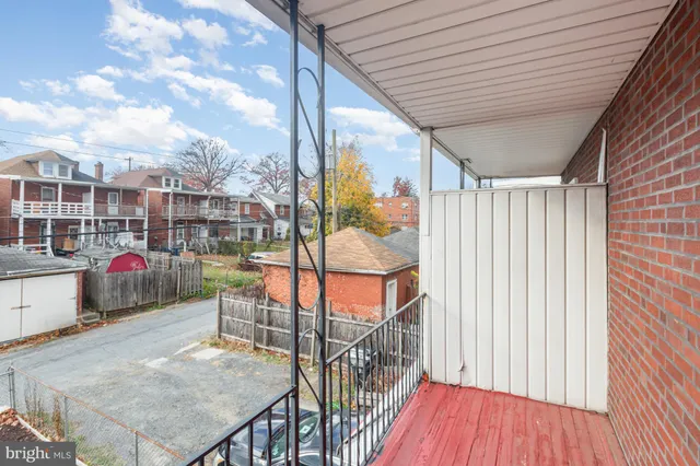 a view of a balcony with furniture