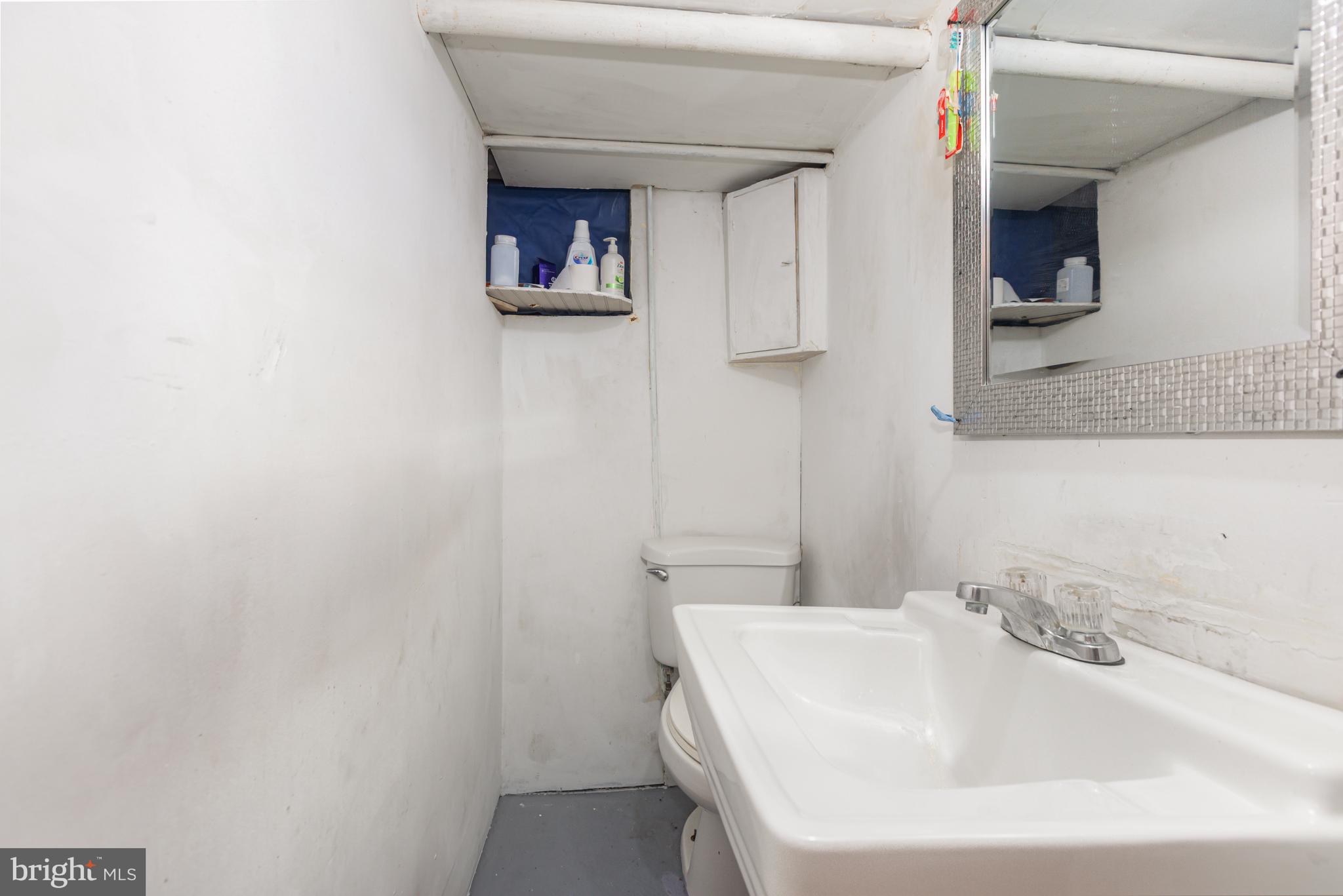 1204 North 16th Street Harrisburg, PA 17103 - Photo 25 of 30 a bathroom with a sink and a mirror