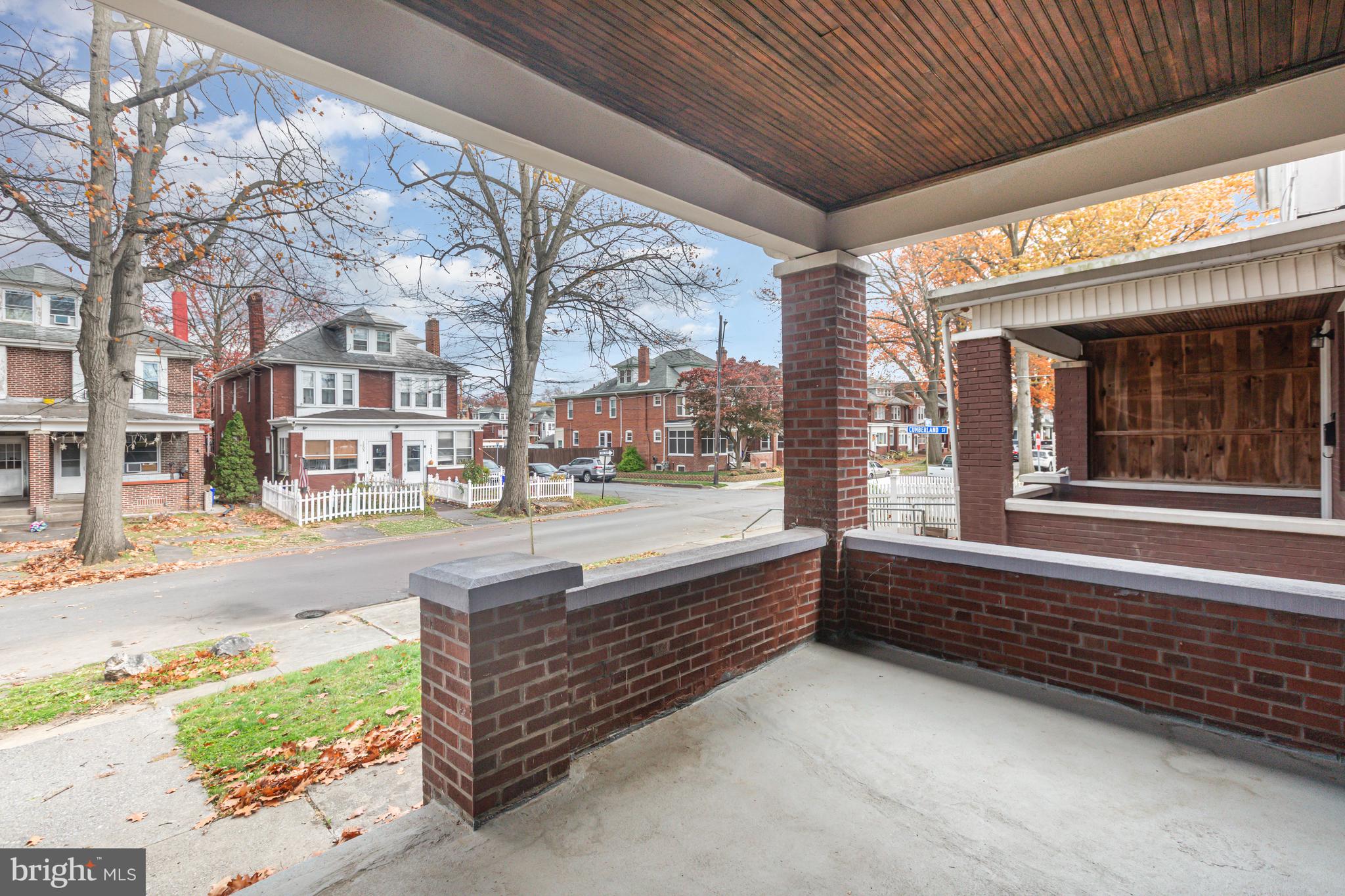1204 North 16th Street Harrisburg, PA 17103 - Photo 3 of 30 a view of a porch with a bench in front of building