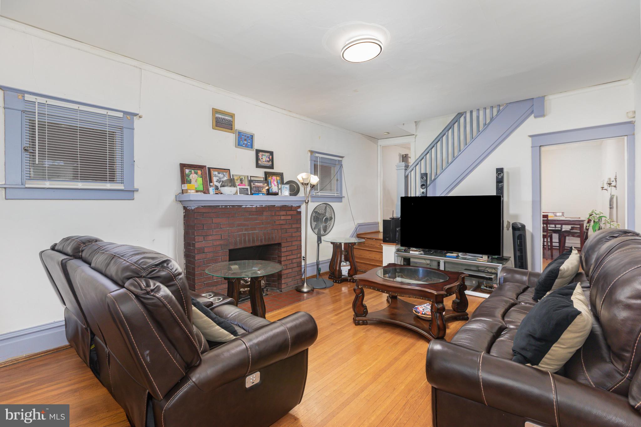 1204 North 16th Street Harrisburg, PA 17103 - Photo 5 of 30 a living room with furniture and a flat screen tv