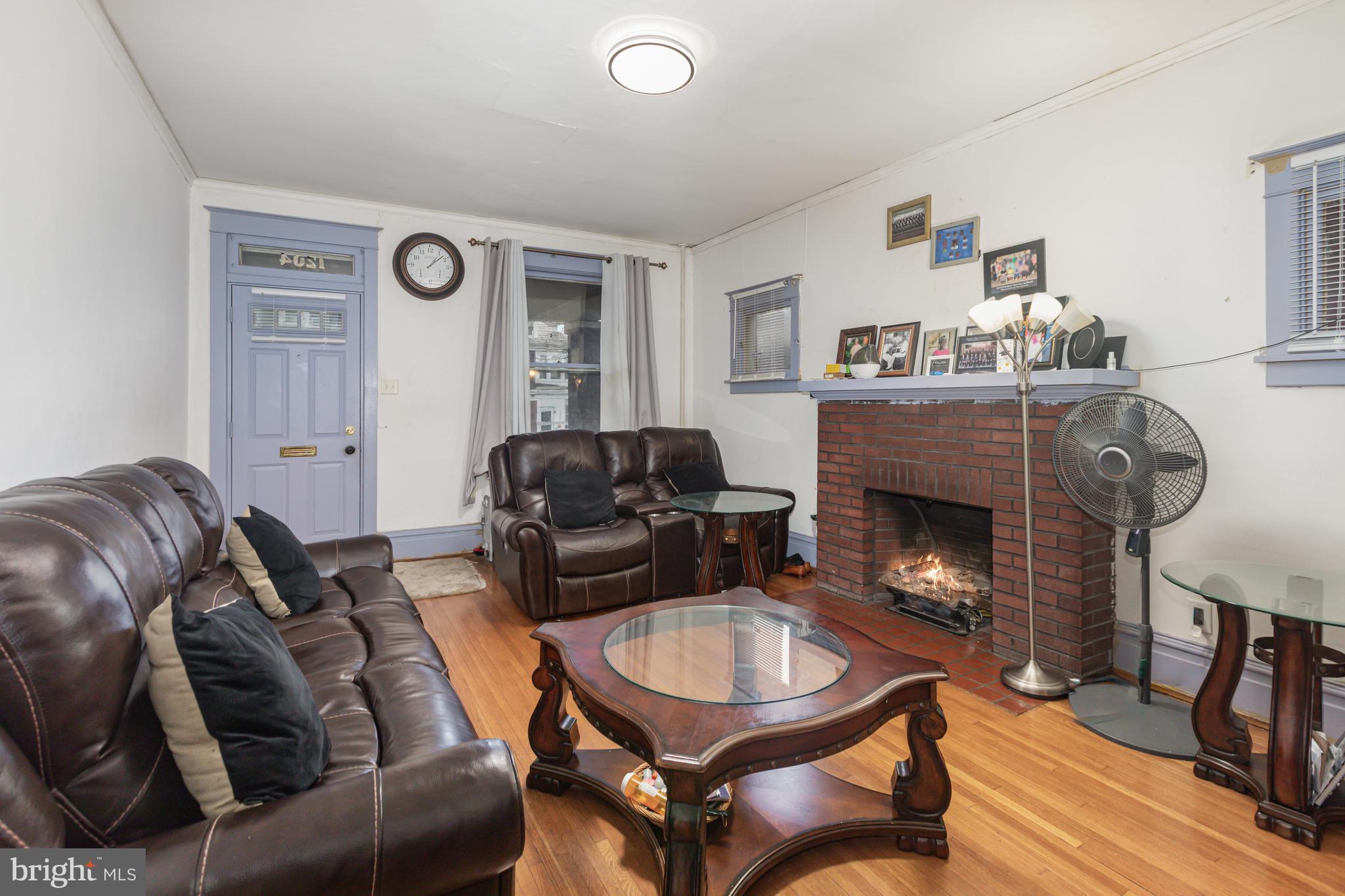 1204 North 16th Street Harrisburg, PA 17103 - Photo 6 of 30 a living room with furniture and a fireplace