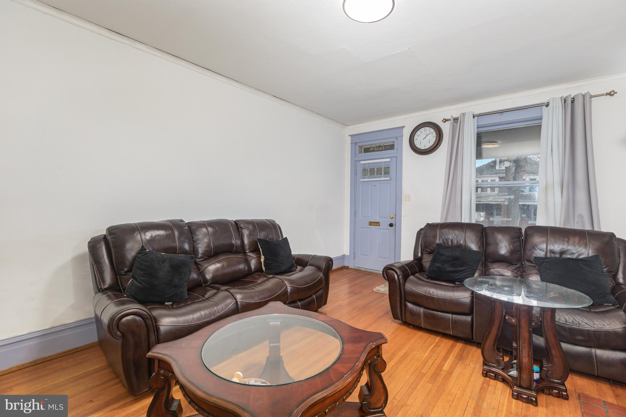 1204 North 16th Street Harrisburg, PA 17103 - Photo 7 of 30 a living room with furniture and a window