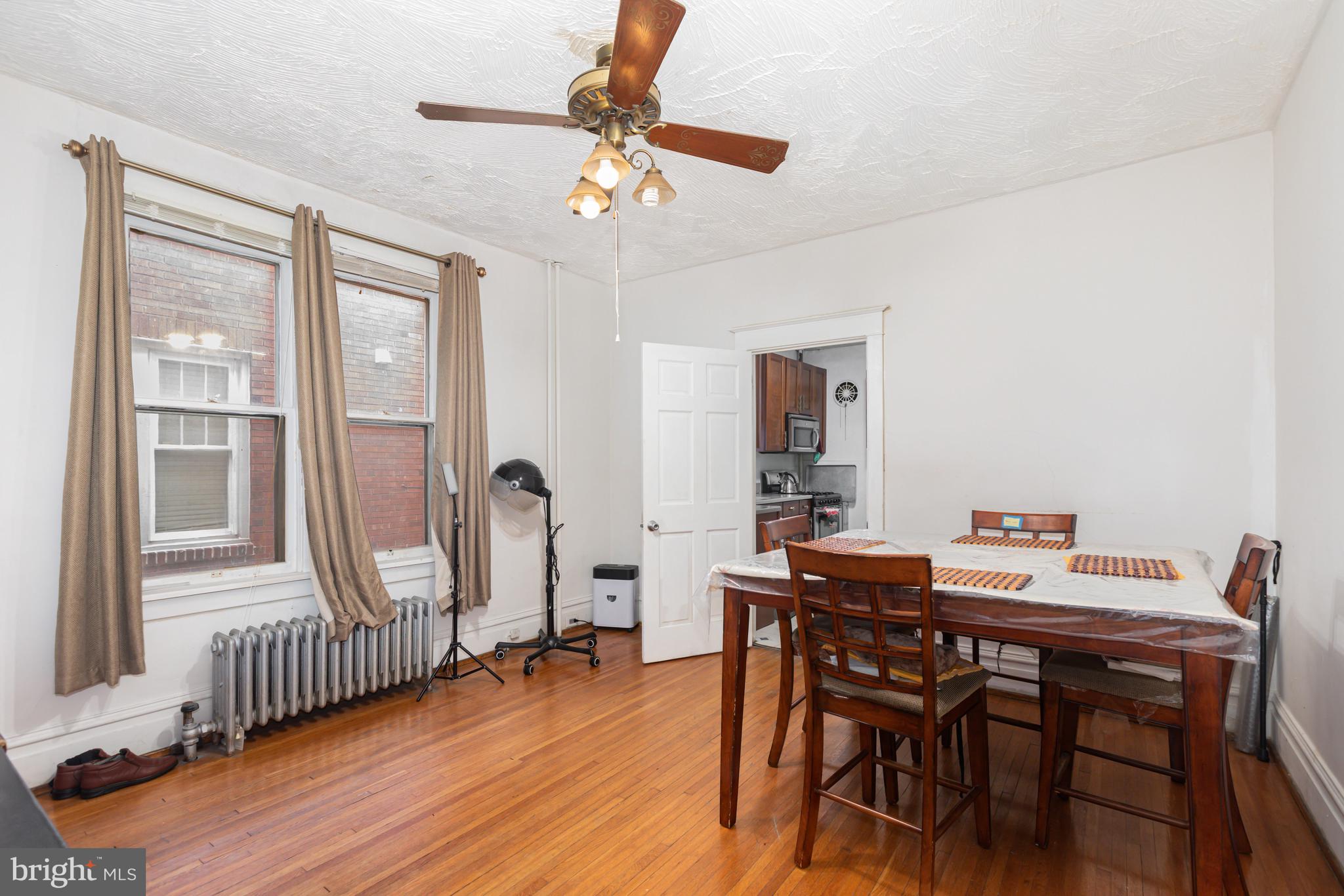 1204 North 16th Street Harrisburg, PA 17103 - Photo 8 of 30 a view of a dining room with furniture window and wooden floor