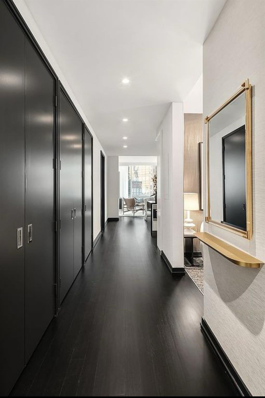 157 West 57th Street, Unit 33E Manhattan, NY 10019 - Photo 4 of 12 Hall with dark hardwood / wood-style flooring