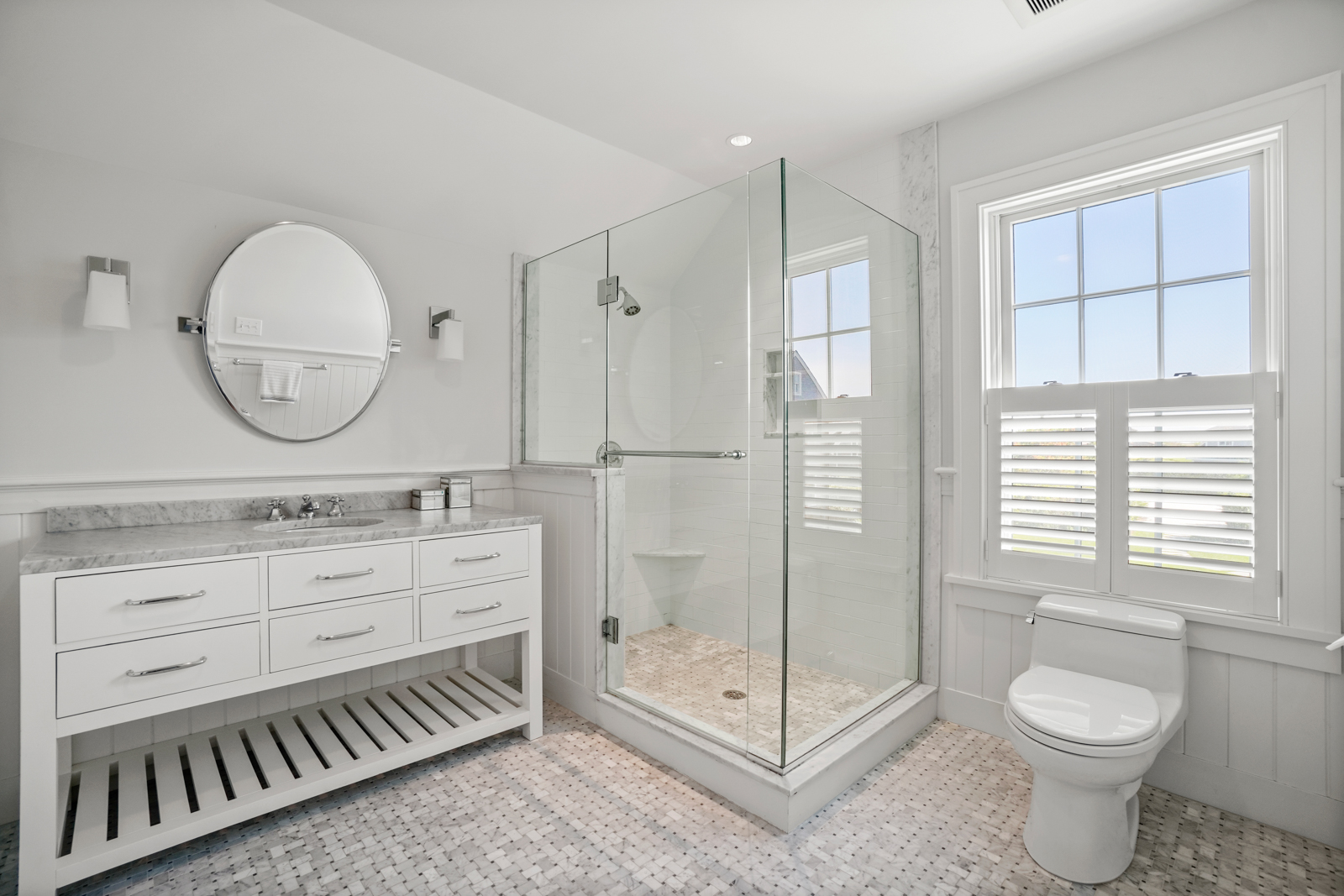 2 Marion Avenue Nantucket, MA 02554 - Photo 40 of 43 a bathroom with a toilet a sink and glass door