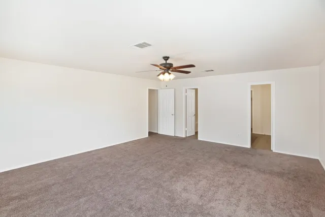 a view of a big room with carpet