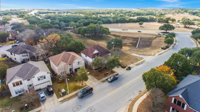 an aerial view of a house with a lake view
