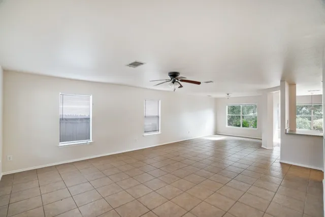 a view of empty room with windows