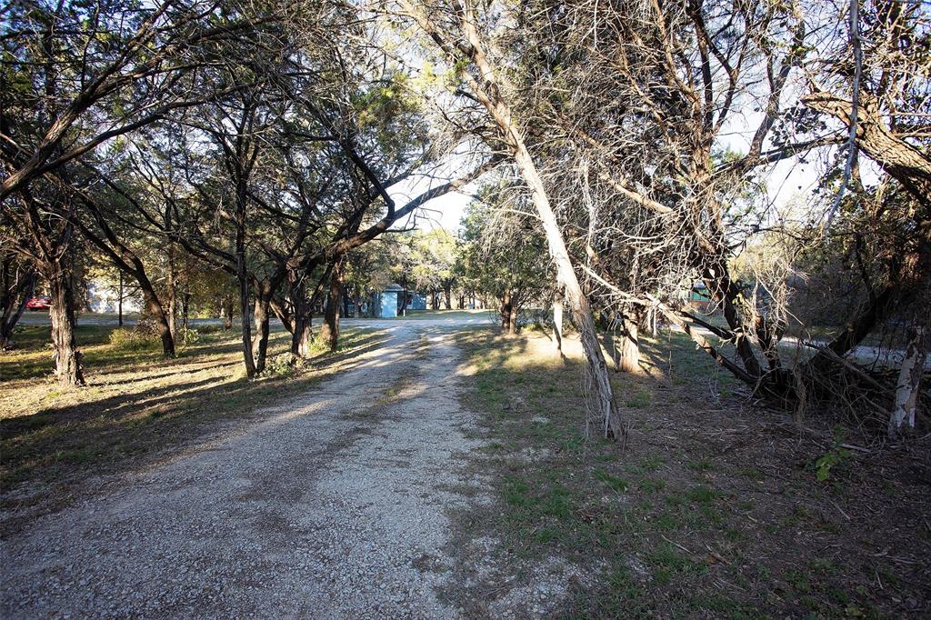 9051 Lacy Road Graford, TX 76449 - Photo 22 of 23 a view of outdoor space with trees