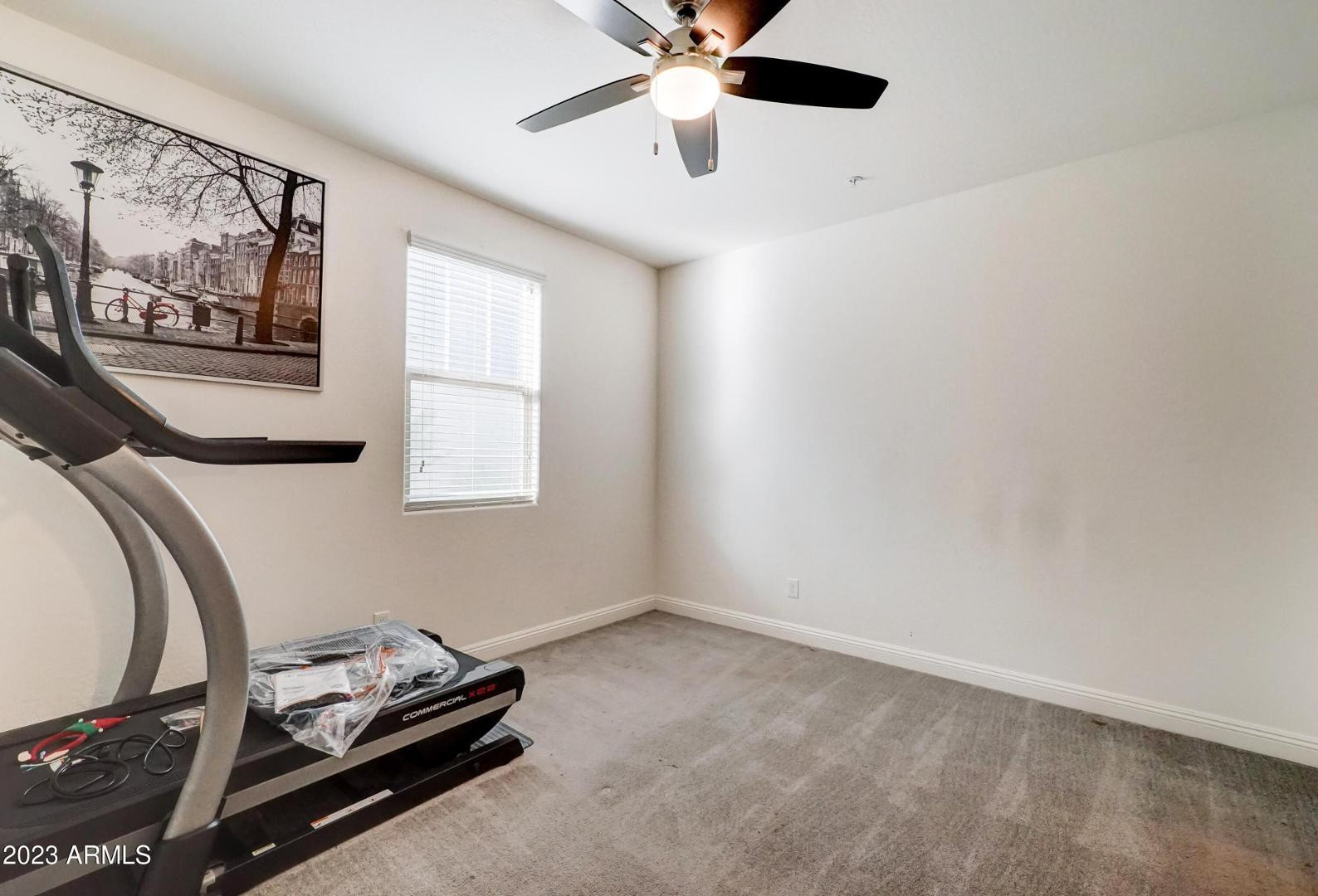 2297 North Alsap Road Buckeye, AZ 85396 - Photo 24 of 36 a room with gym equipment and a window