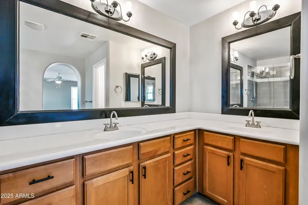 a kitchen with granite countertop a stove and a wooden floors