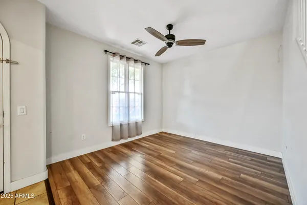 a view of a living room with wooden floor