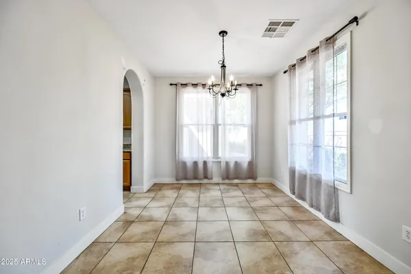 a view of empty room with wooden floor and fireplace
