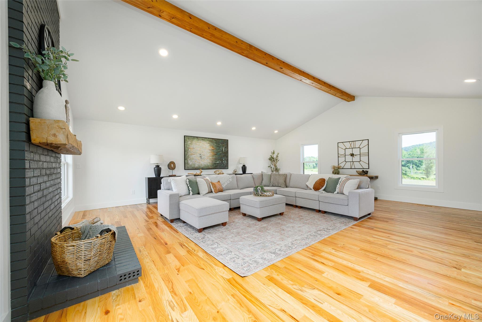 327 Hynes Road Poughquag, NY 12570 - Photo 14 of 39 Living room featuring recessed lighting, beam ceiling, light wood-type flooring, a fireplace, and high vaulted ceiling