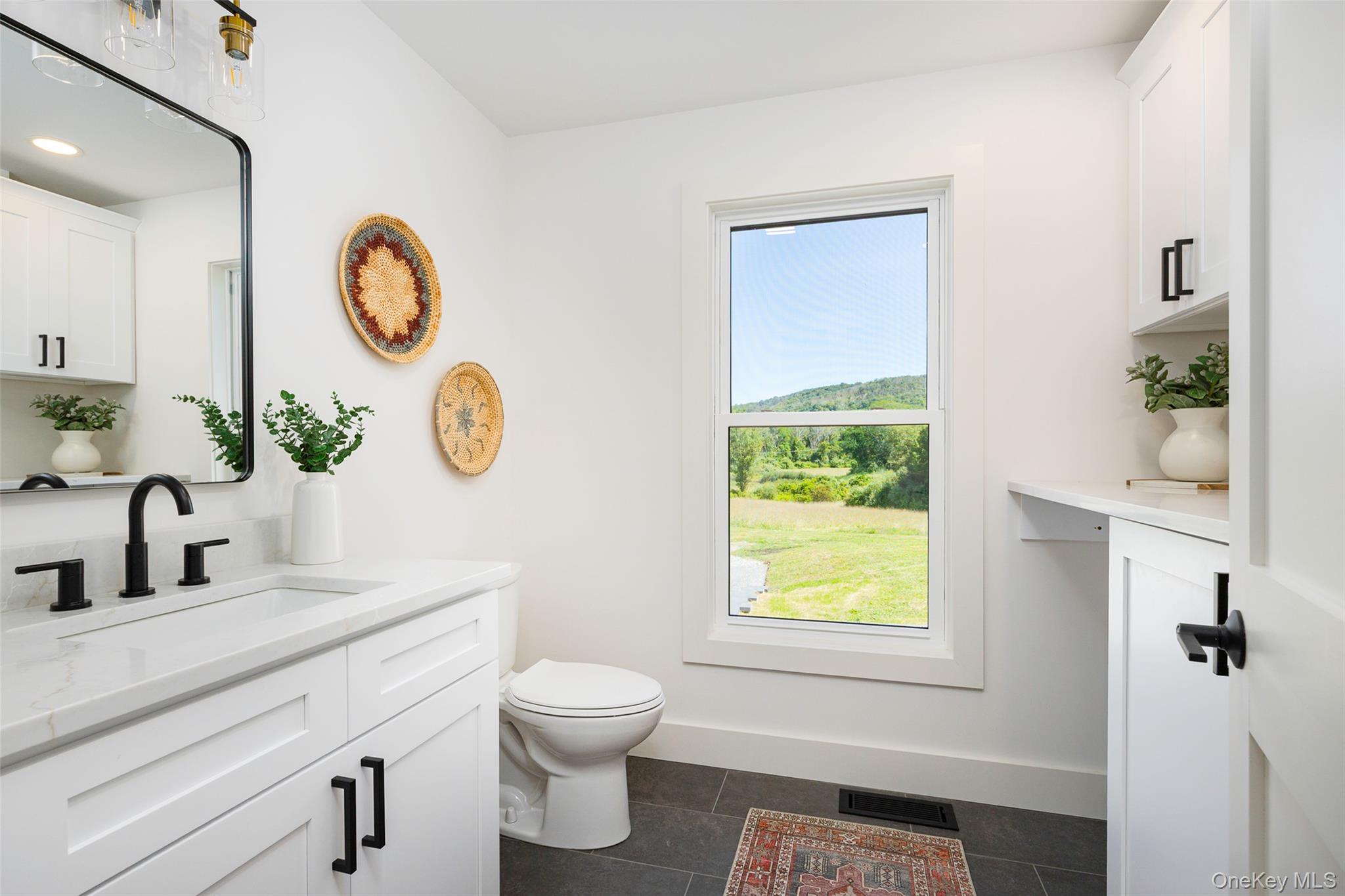 327 Hynes Road Poughquag, NY 12570 - Photo 17 of 39 Half bathroom with vanity and dark tile patterned floors