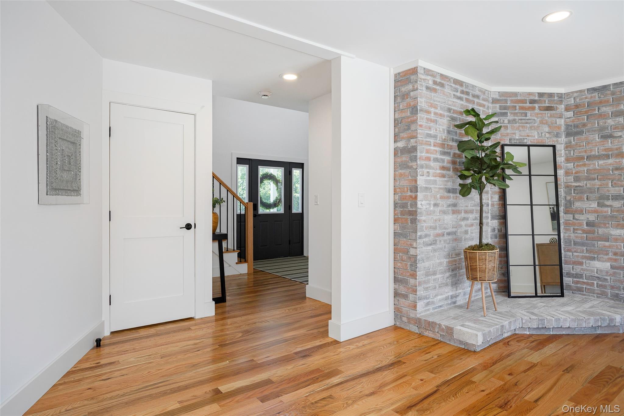 327 Hynes Road Poughquag, NY 12570 - Photo 19 of 39 Foyer entrance with light wood-type flooring, recessed lighting, stairway, and brick wall