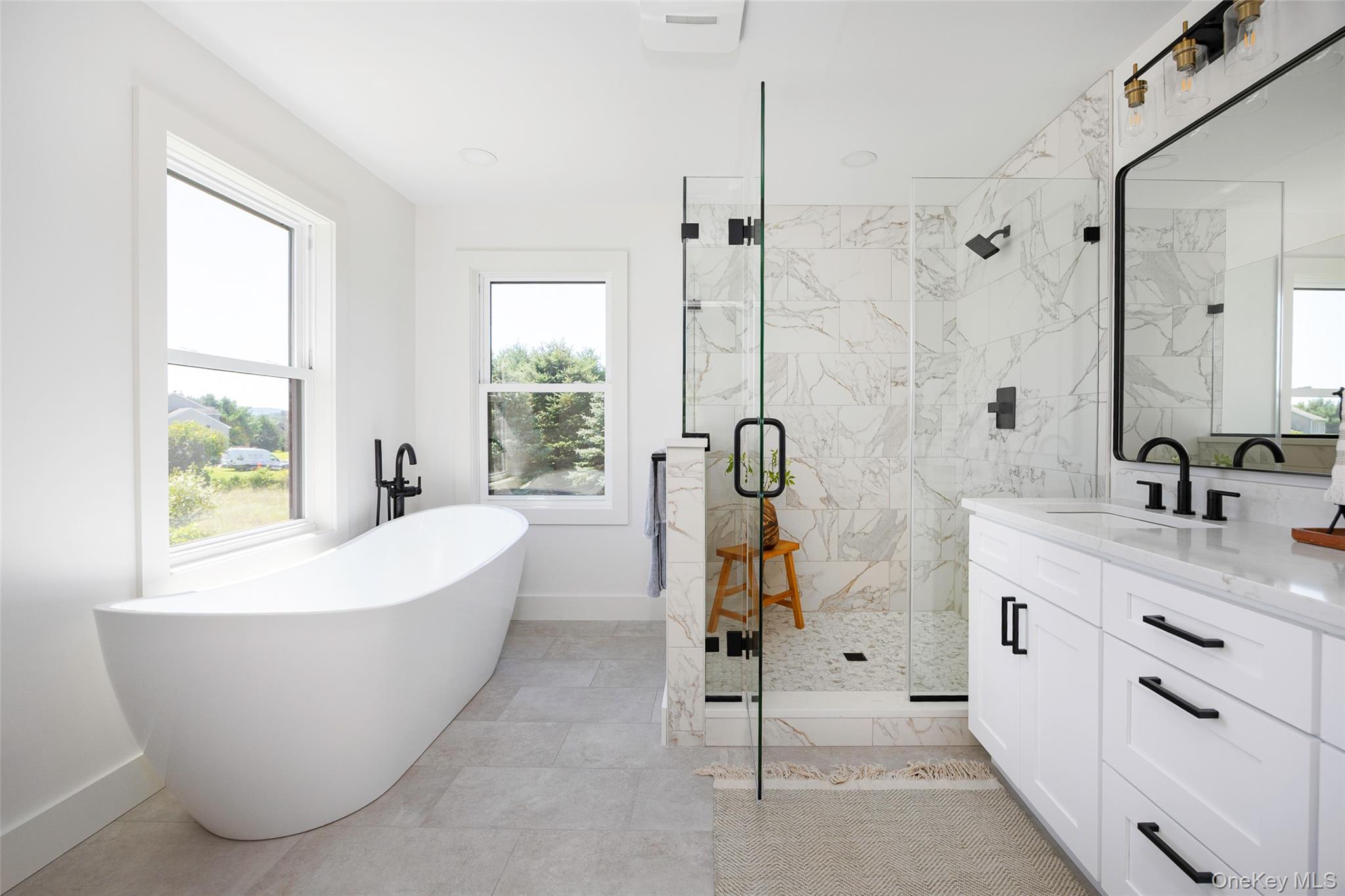 327 Hynes Road Poughquag, NY 12570 - Photo 24 of 39 Bathroom with vanity, a marble finish shower, and a soaking tub