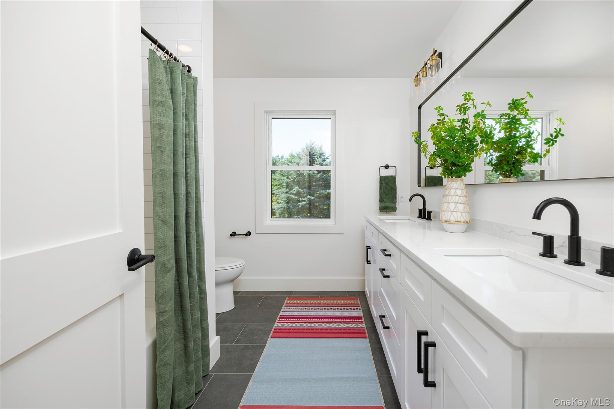 327 Hynes Road Poughquag, NY 12570 - Photo 29 of 39 Full bathroom featuring double vanity, dark tile patterned floors, and curtained shower