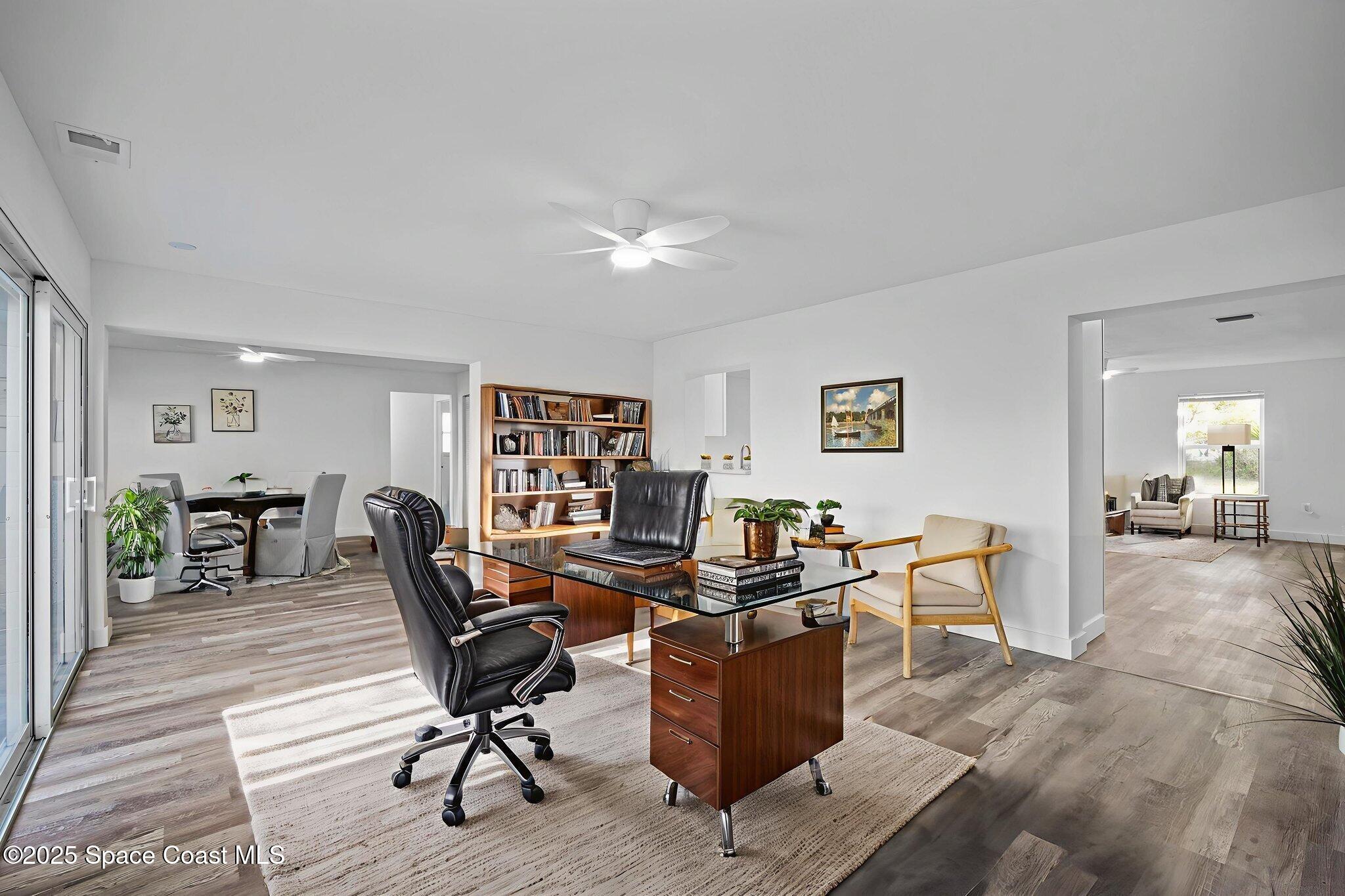 1390 Island Drive Merritt Island, FL 32952 - Photo 18 of 48 25-web-or-mls-Family Room virtually stag