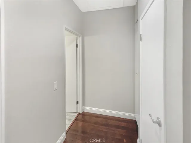 a utility room with granite countertop cabinets washer and dryer