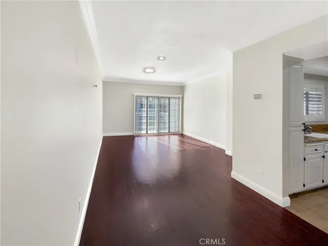 a view of a hallway with washer and dryer