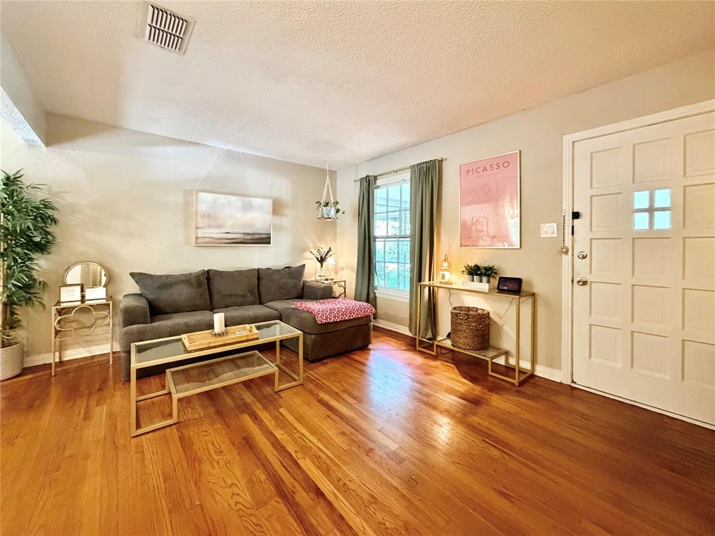 919 Denton Street Denton, TX 76201 - Photo 4 of 19 a living room with furniture and a wooden floor