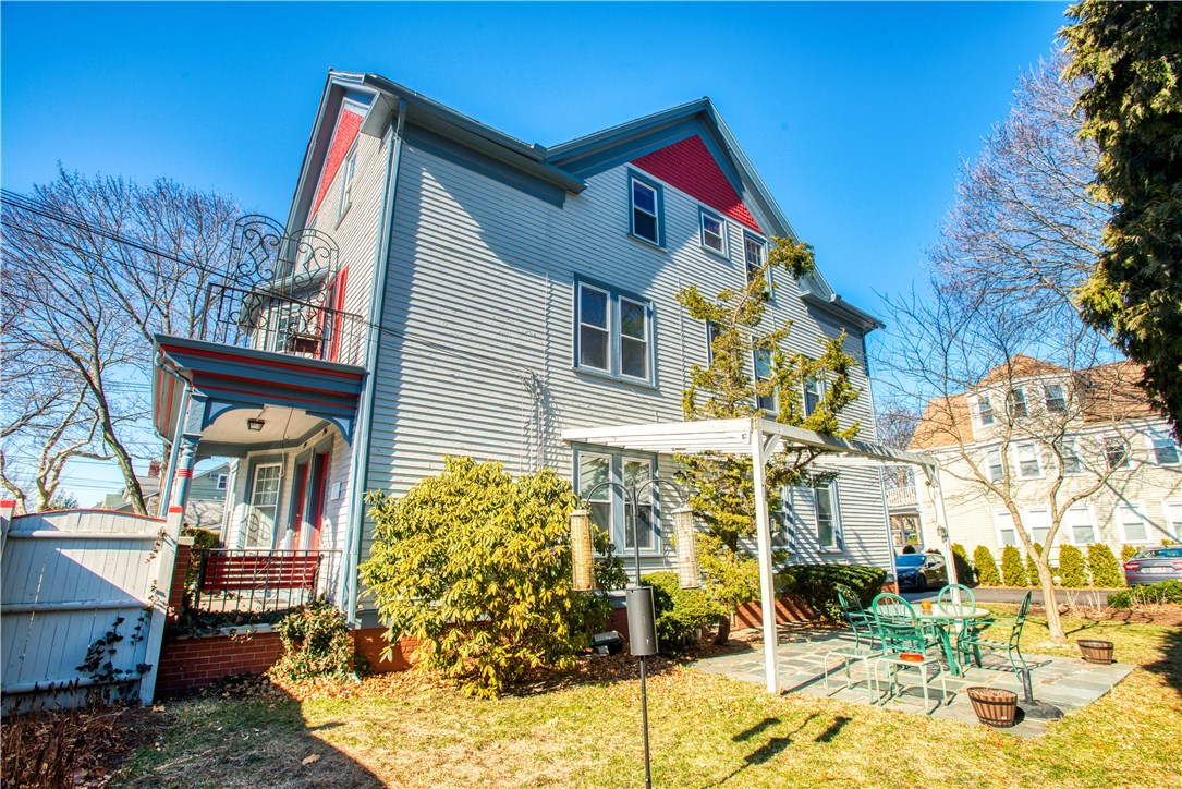 194 Rochambeau Avenue Providence, RI 02906 - Photo 21 of 28 side yard with patio and pergola