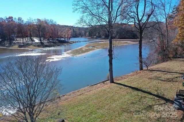 a view of a house with backyard and porch