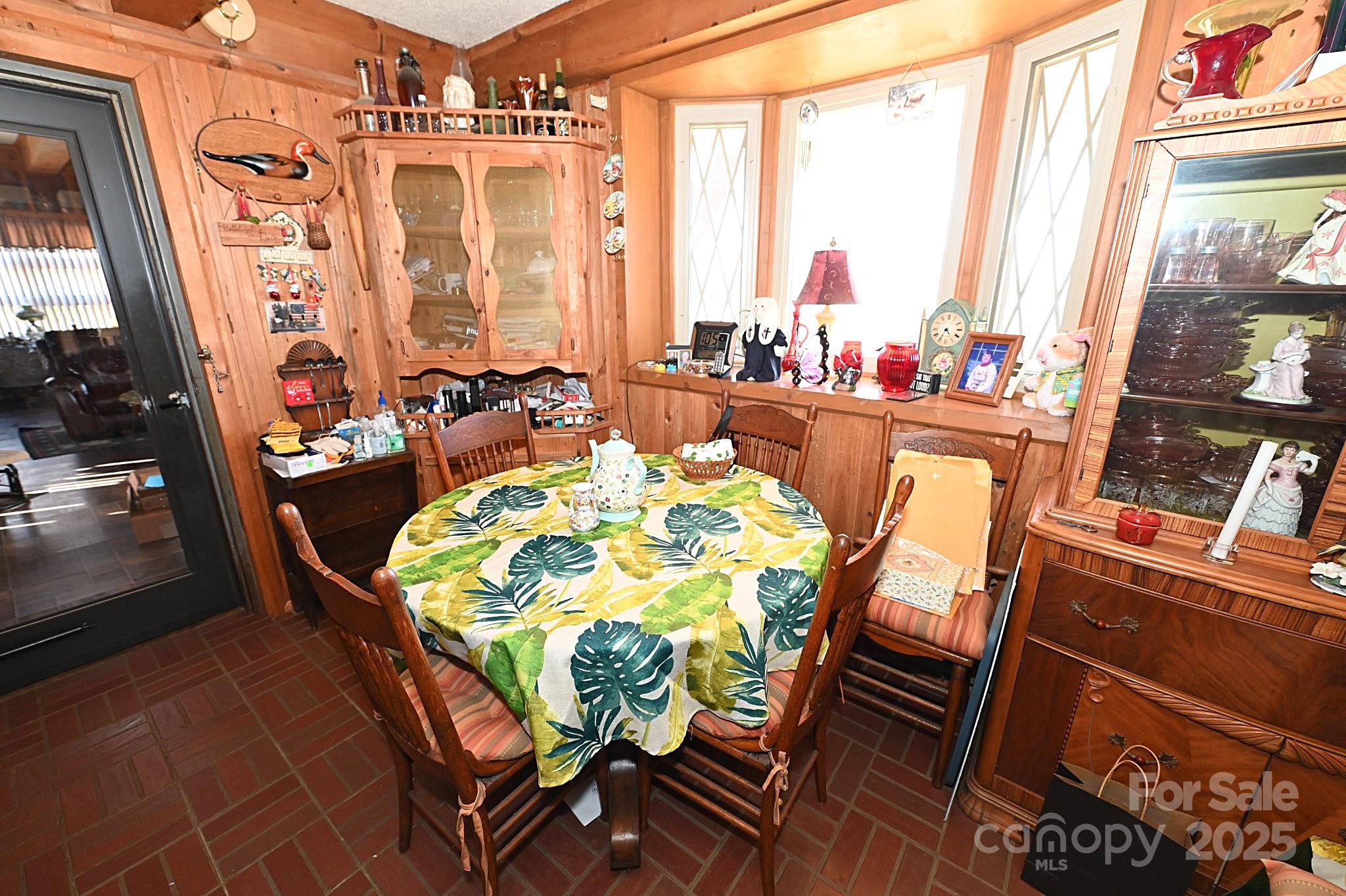 1859 Kale Road Catawba, NC 28609 - Photo 10 of 17 a view of a dining room with furniture a chandelier and large windows