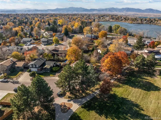 an aerial view of residential building with outdoor space and lake view