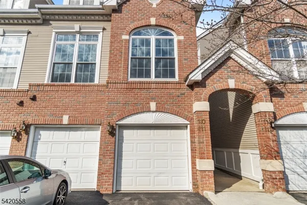 a front view of a house with parking