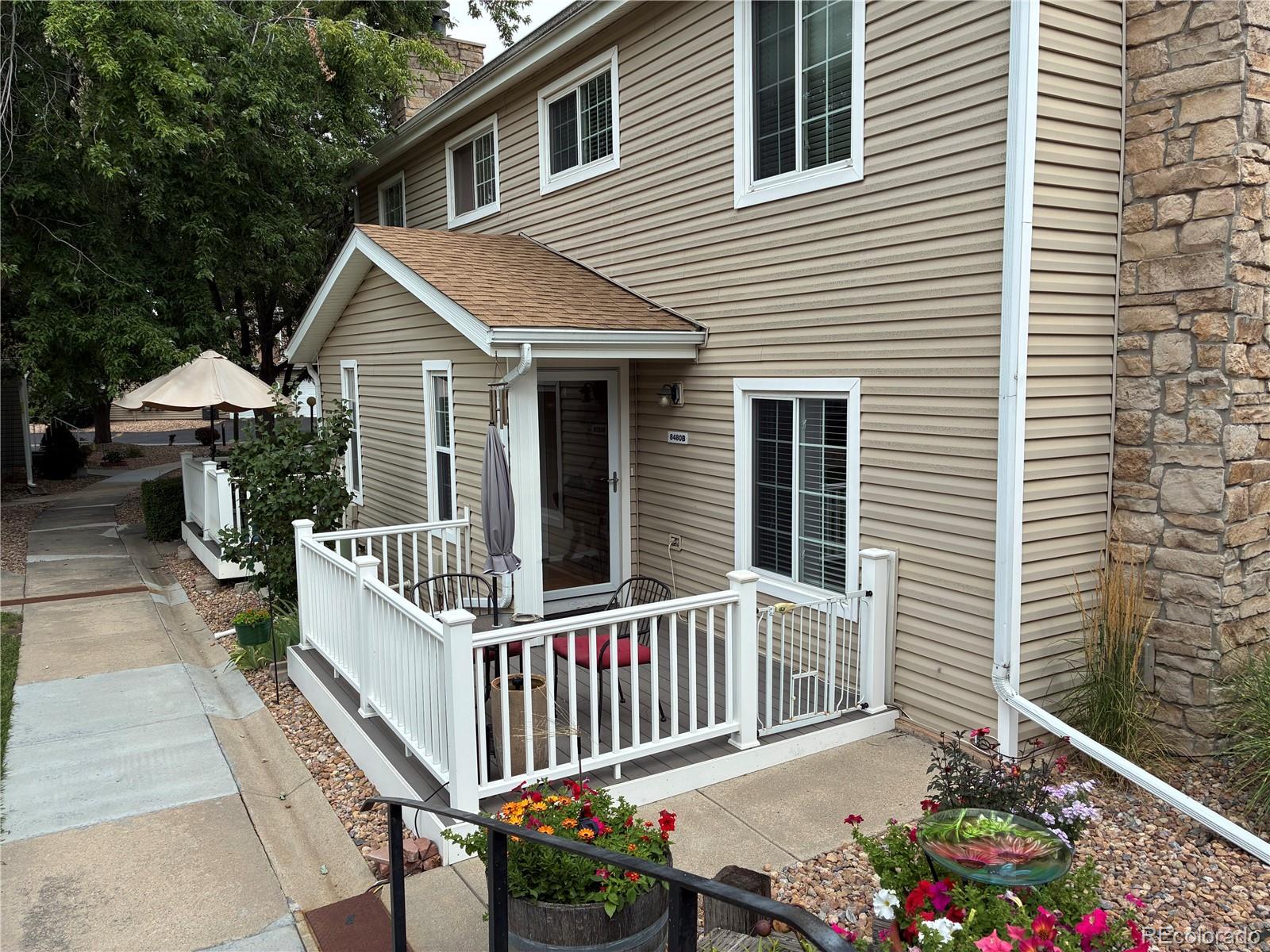 a view of a house with wooden fence