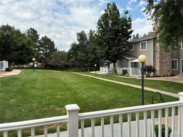 a front view of a house with a yard table and chairs
