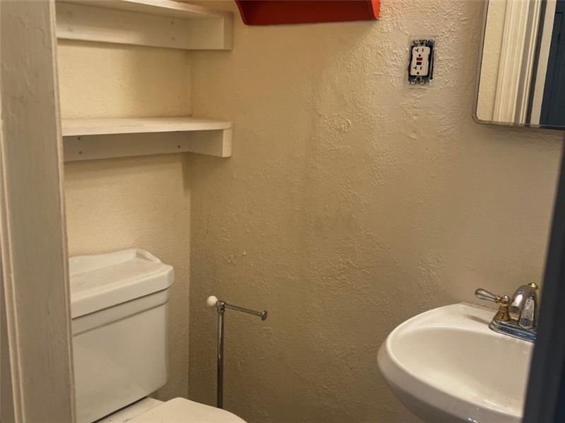 977 Lindridge Way Northeast Atlanta, GA 30324 - Photo 11 of 18 a bathroom with a sink and a toilet