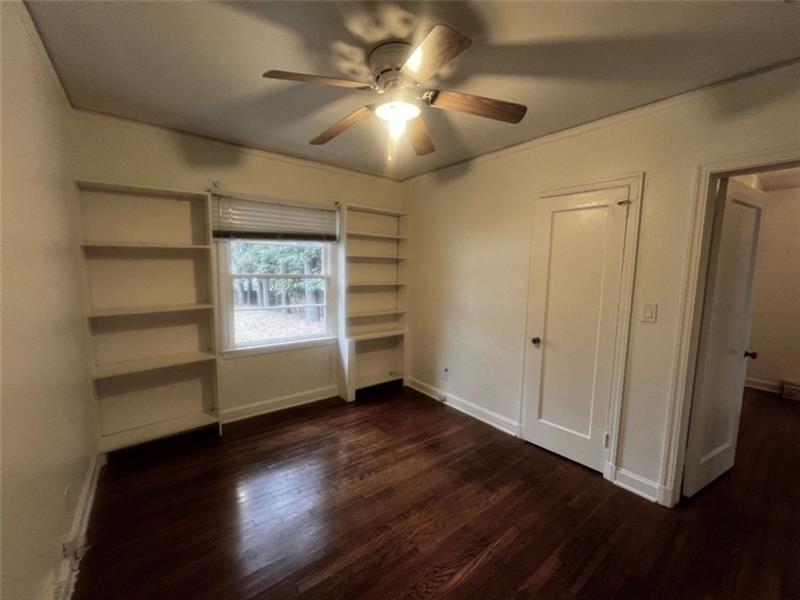 977 Lindridge Way Northeast Atlanta, GA 30324 - Photo 14 of 18 a view of an empty room with a window and wooden floor