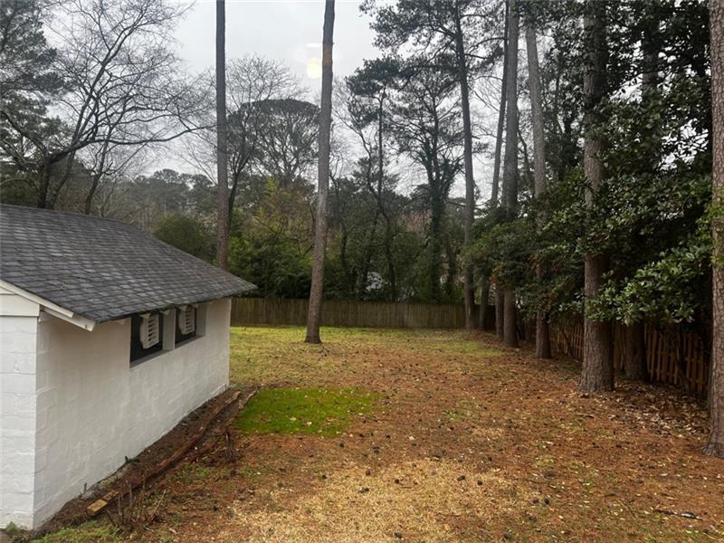 977 Lindridge Way Northeast Atlanta, GA 30324 - Photo 18 of 18 a backyard of a house with lots of trees