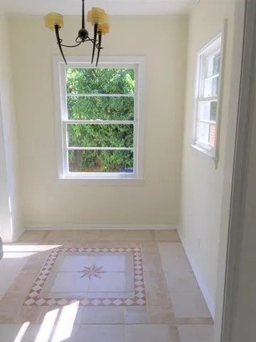 a view of empty room with windows