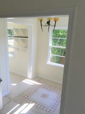 a view of a room that has a window in it