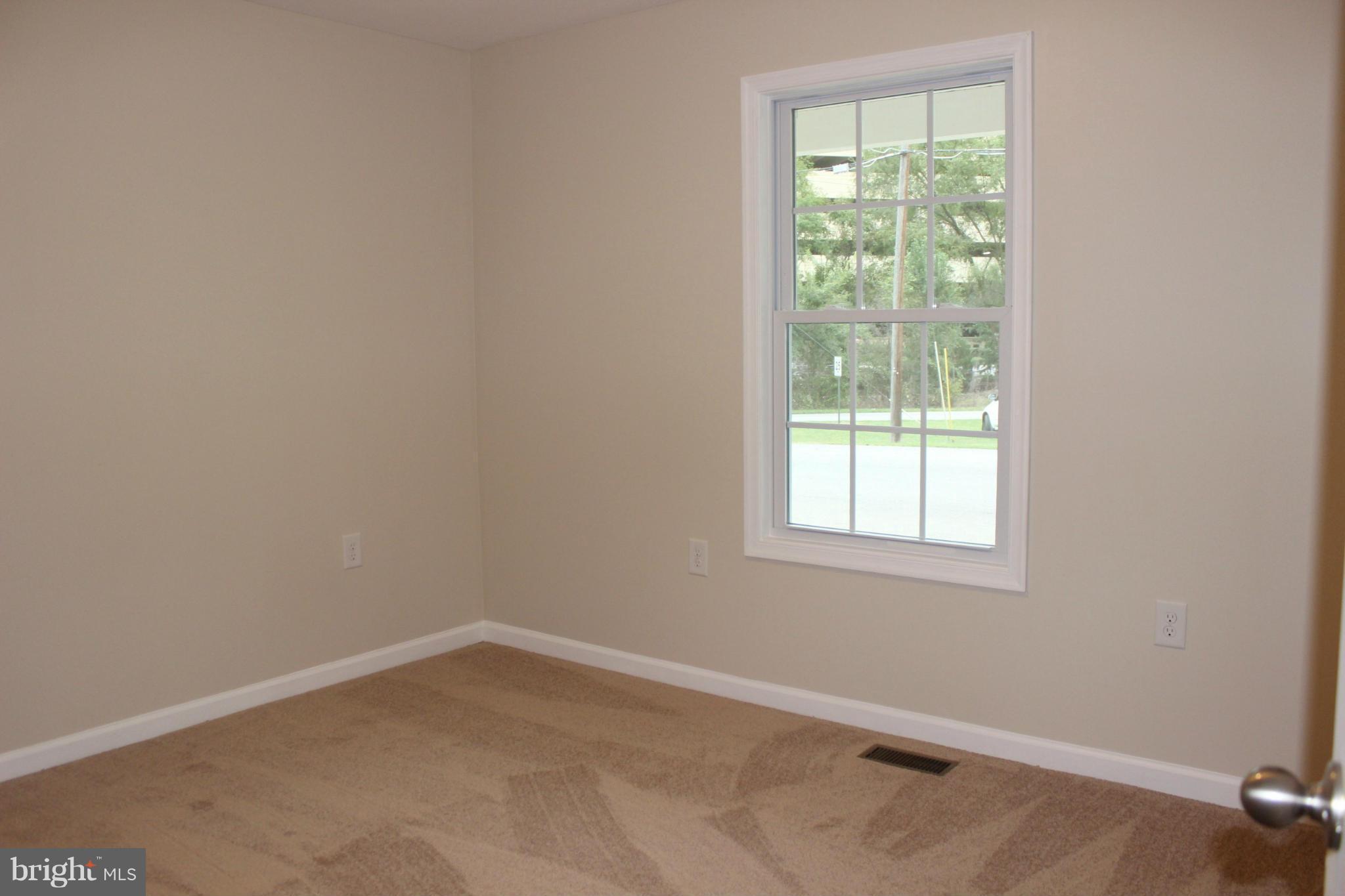 321 East 3rd Avenue Ranson, WV 25438 - Photo 12 of 15 an empty room with a window