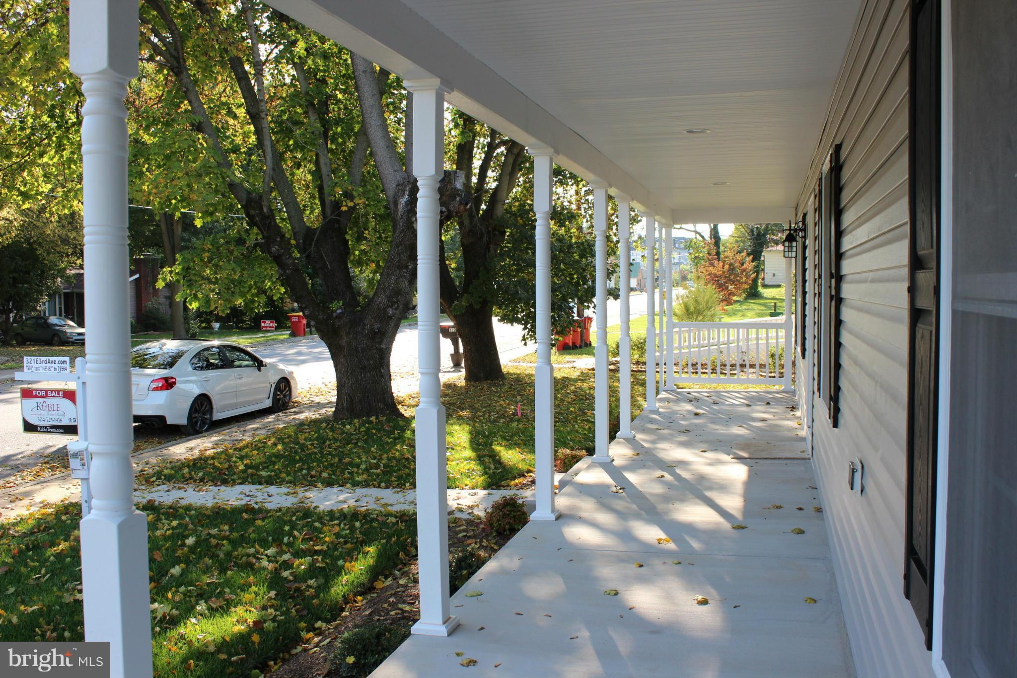 321 East 3rd Avenue Ranson, WV 25438 - Photo 3 of 15 a view of a porch with chairs and backyard