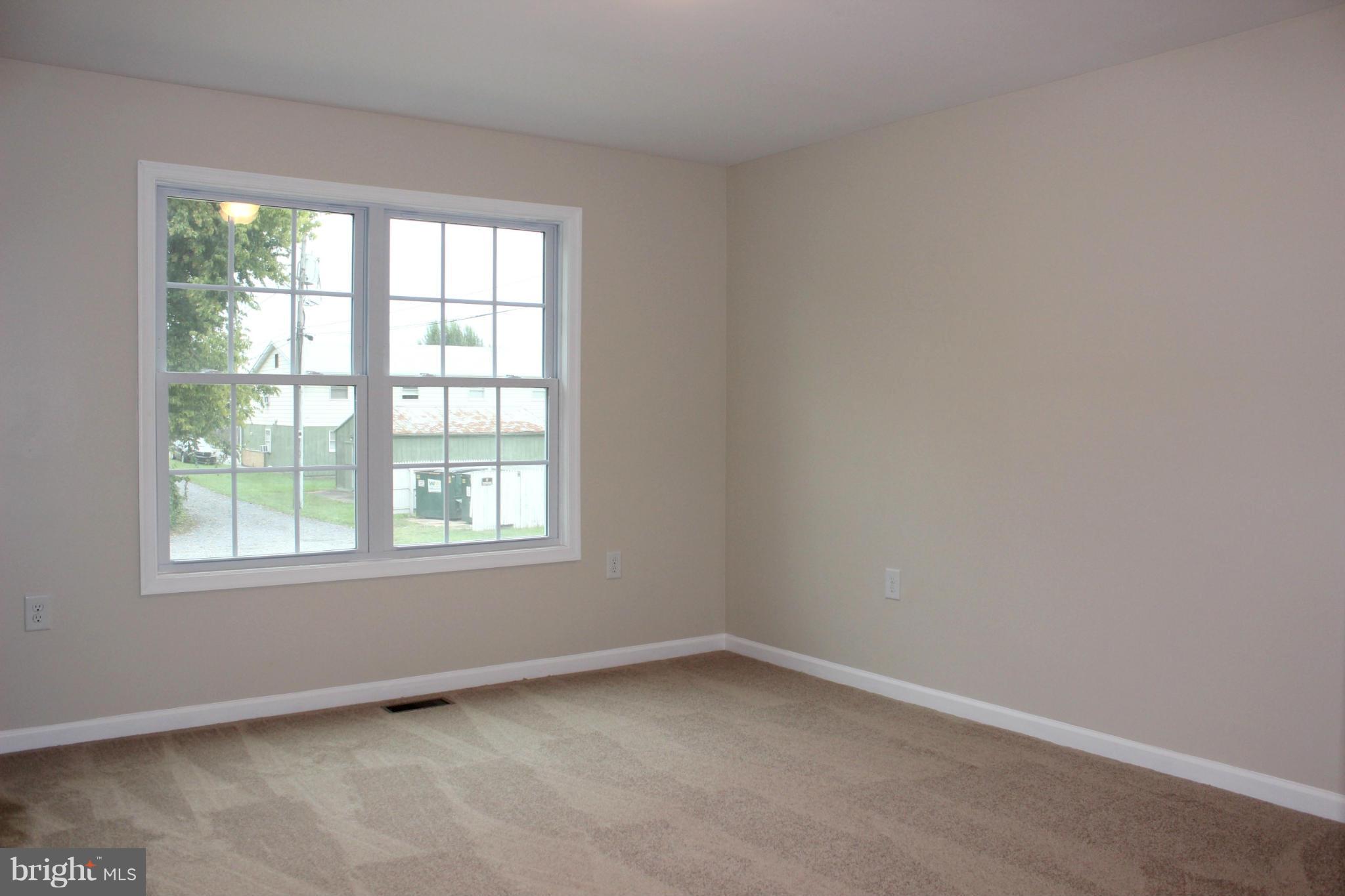 321 East 3rd Avenue Ranson, WV 25438 - Photo 9 of 15 an empty room with a window