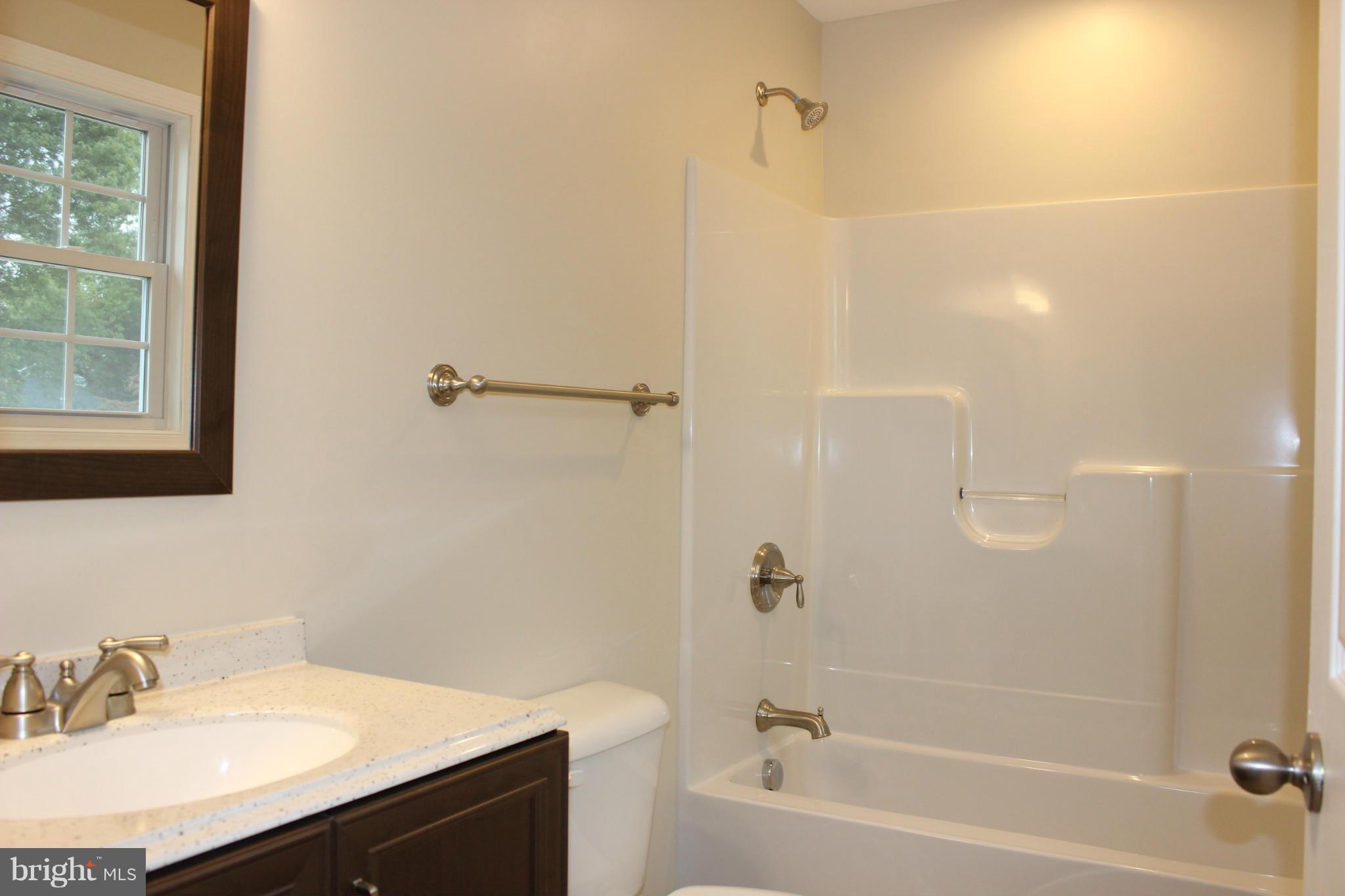 321 East 3rd Avenue Ranson, WV 25438 - Photo 10 of 15 a bathroom with a sink and a mirror