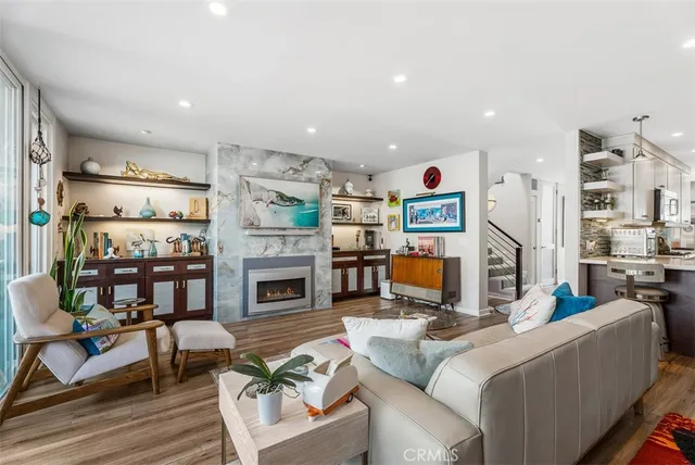 a living room with fireplace furniture and a flat screen tv