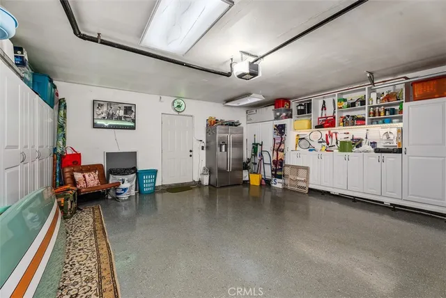 a gym room with furniture and a rug