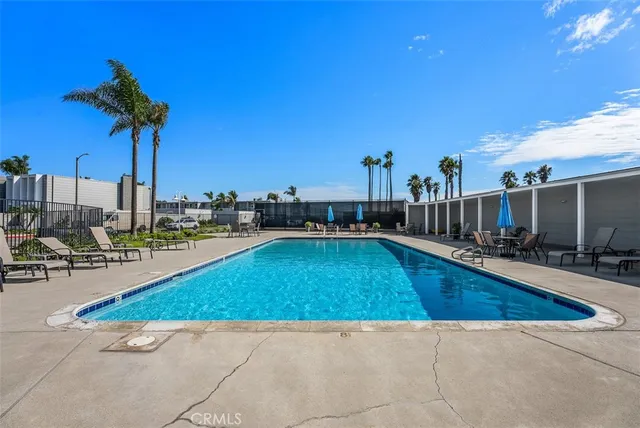 a view of a swimming pool with a lounge chairs