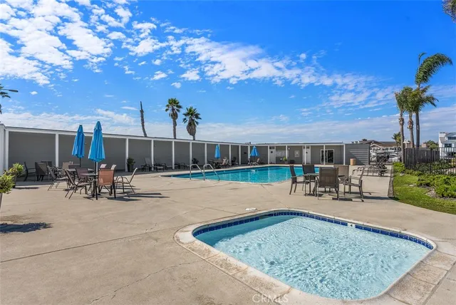 a view of a backyard with sitting area and furniture