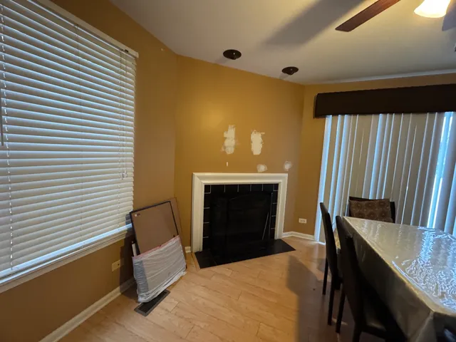 a bedroom with a bed and a fireplace