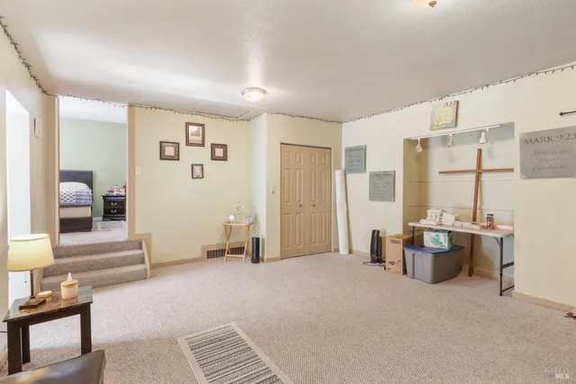 a view of a livingroom with furniture and windows